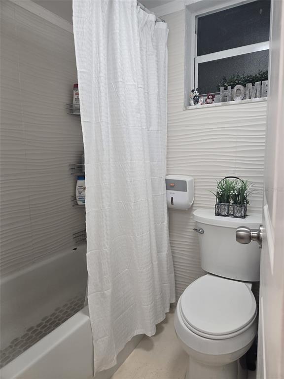 9410 Live Oak Place, Unit 103 Davie, FL 33324 - Photo 24 of 49 a white toilet sitting next to a shower