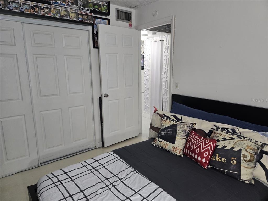 9410 Live Oak Place, Unit 103 Davie, FL 33324 - Photo 27 of 49 a bedroom with a bed and a window