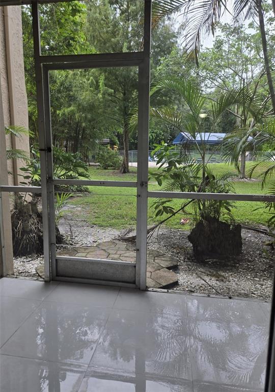 9410 Live Oak Place, Unit 103 Davie, FL 33324 - Photo 33 of 49 a view of a yard with porch and outdoor seating