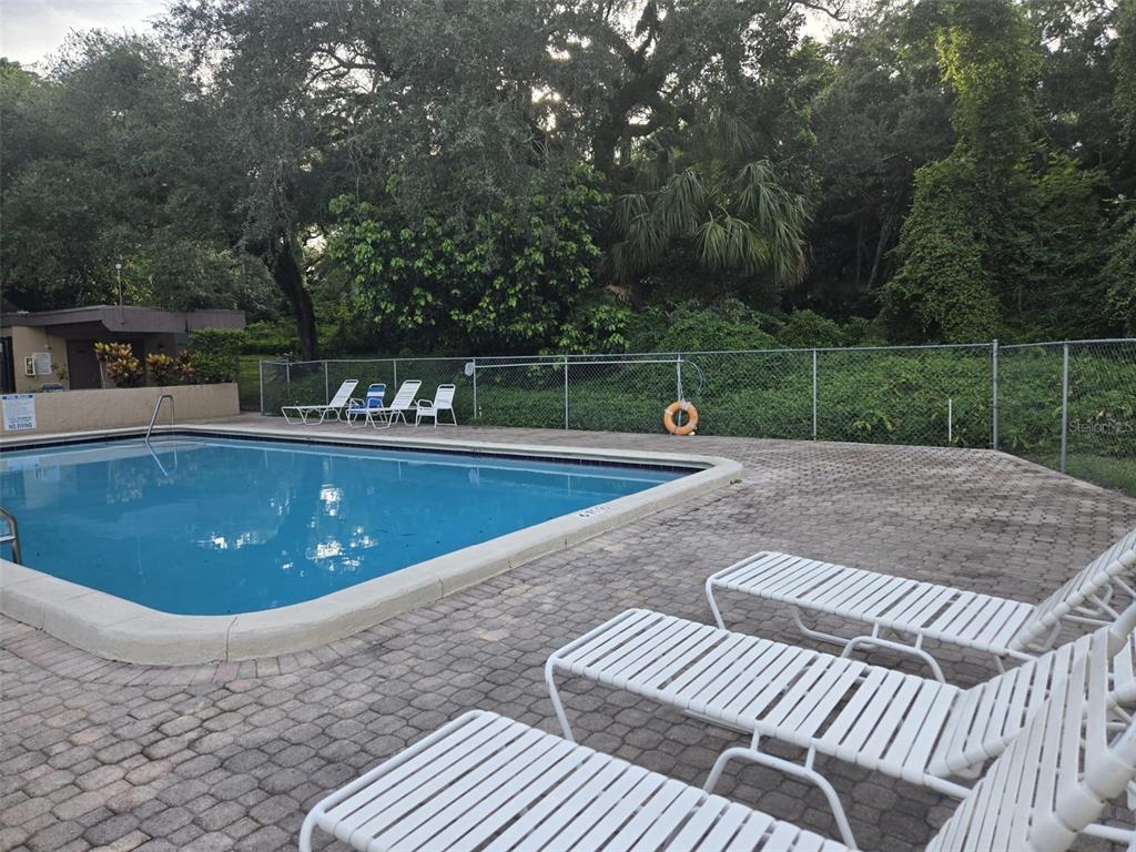 9410 Live Oak Place, Unit 103 Davie, FL 33324 - Photo 34 of 49 a view of a swimming pool with a patio