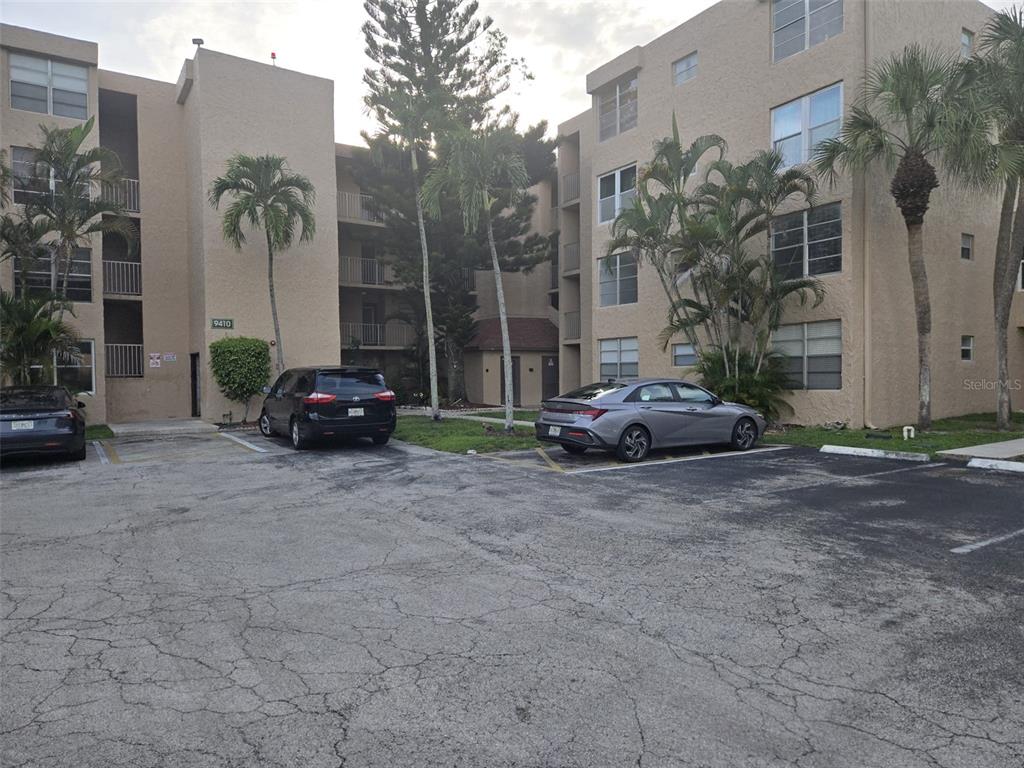 9410 Live Oak Place, Unit 103 Davie, FL 33324 - Photo 37 of 49 a view of car parked in front of building