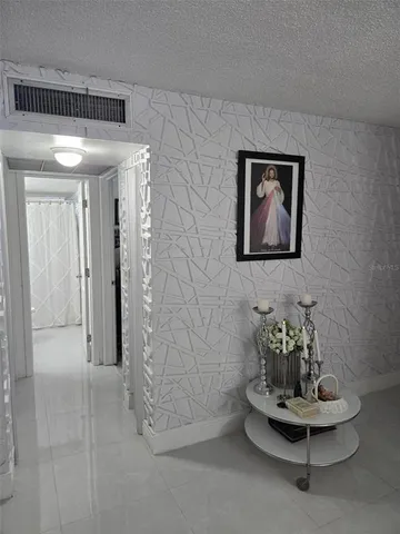 a view of hall way with furniture