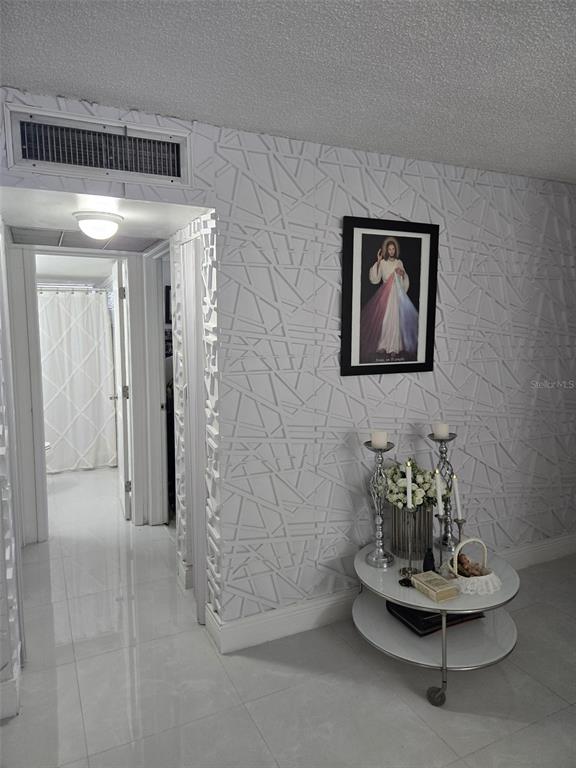 9410 Live Oak Place, Unit 103 Davie, FL 33324 - Photo 4 of 49 a view of hall way with furniture