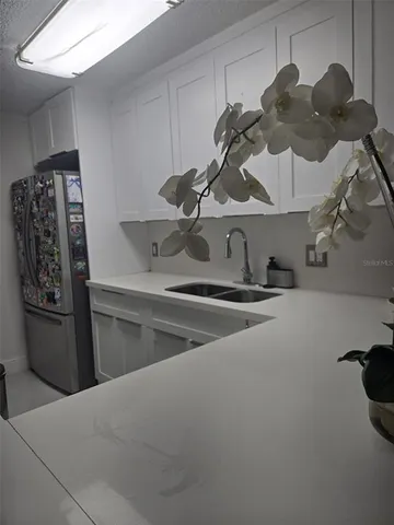 a kitchen with a sink and cabinets