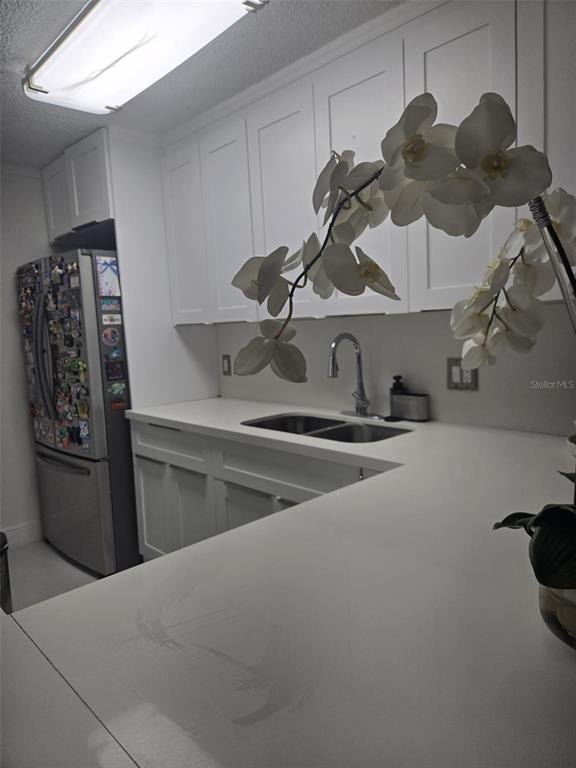 9410 Live Oak Place, Unit 103 Davie, FL 33324 - Photo 9 of 49 a kitchen with a sink and cabinets