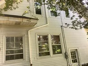 a view of a house with a door and a window