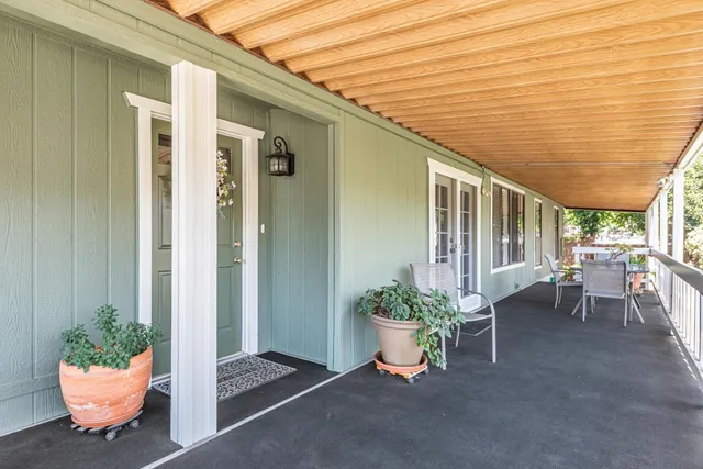 a room with a table and chairs in patio