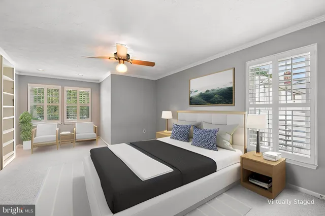 a bedroom with a bed couch and window