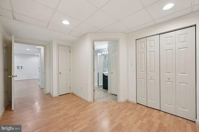 a bedroom with a bed and a closet