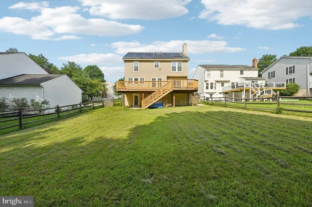 a sign that is sitting on a lush green field