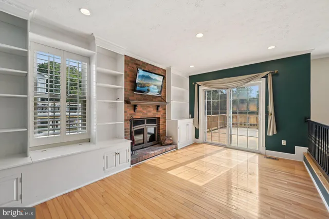 a spacious bedroom with a large bed and a tv