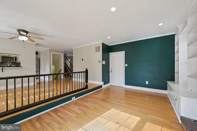 a view of gallery with wooden floor