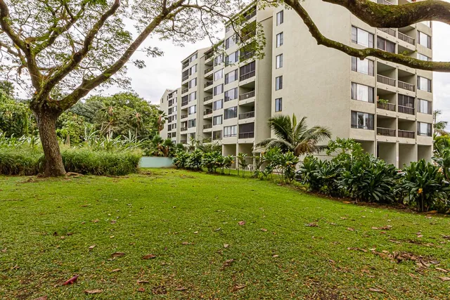 a view of a garden with a building