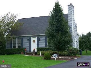 334 Frog Hollow Road Phoenixville, PA 19460 - Photo 1 of 1 a front view of a house with a yard and garage