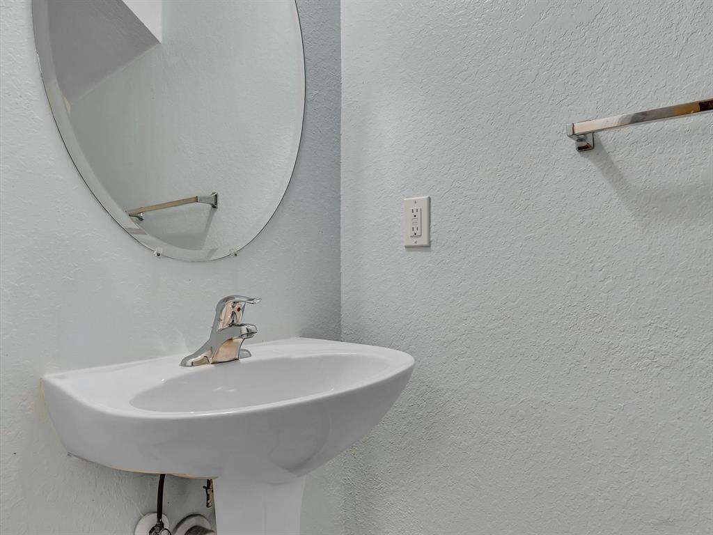 21421 Northwest 13th Court, Unit 211 Miami, FL 33169 - Photo 13 of 18 a bathroom with a sink and a mirror