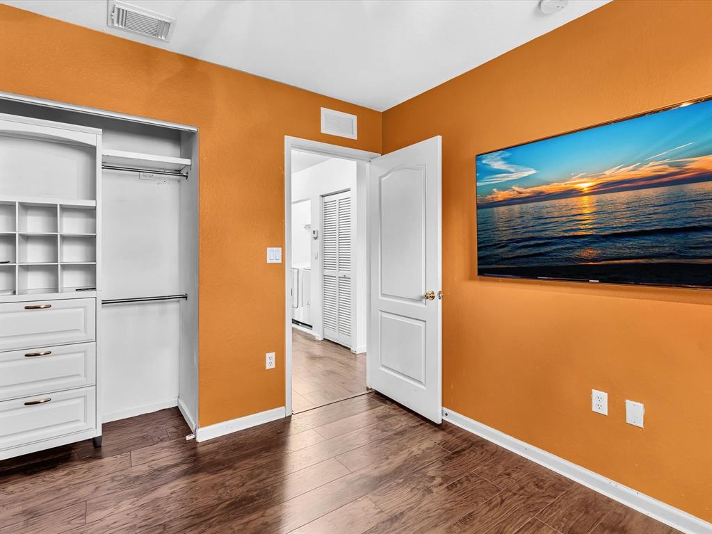 21421 Northwest 13th Court, Unit 211 Miami, FL 33169 - Photo 9 of 18 a view of empty room with wooden floor