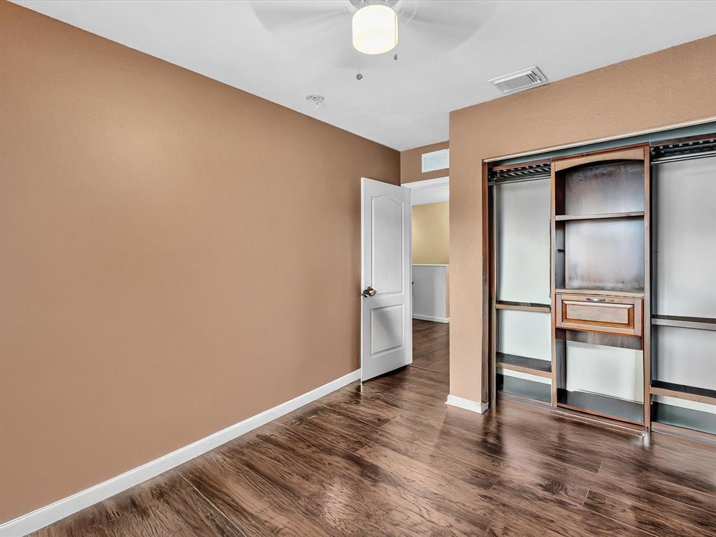 21421 Northwest 13th Court, Unit 211 Miami, FL 33169 - Photo 10 of 18 a view of empty room with wooden floor