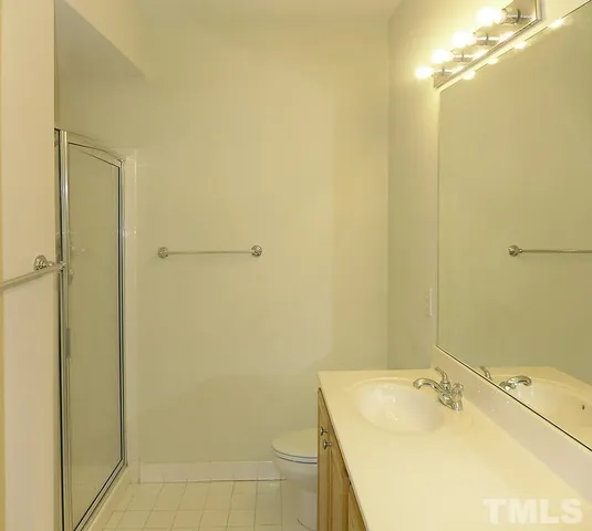 a bathroom with a shower and a sink