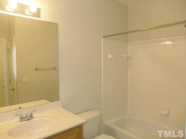 a front view of house with yard and outdoor seating