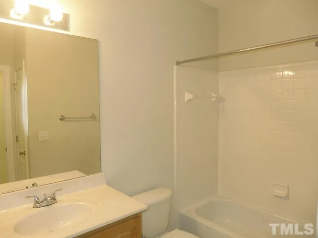 a front view of house with yard and outdoor seating