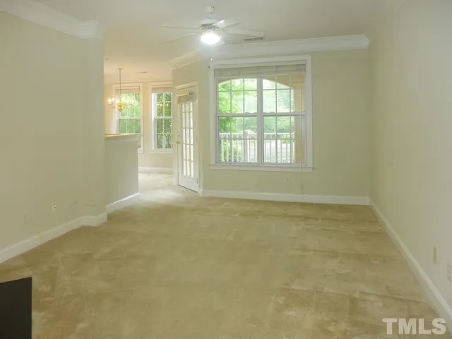 an empty room with a empty space and windows