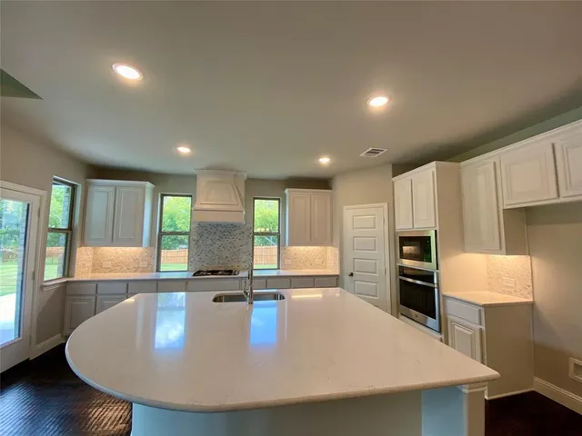 a bathroom with a stove and a microwave