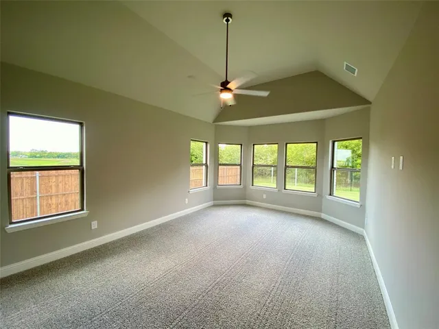 a bathroom with a tub sink shower and mirror