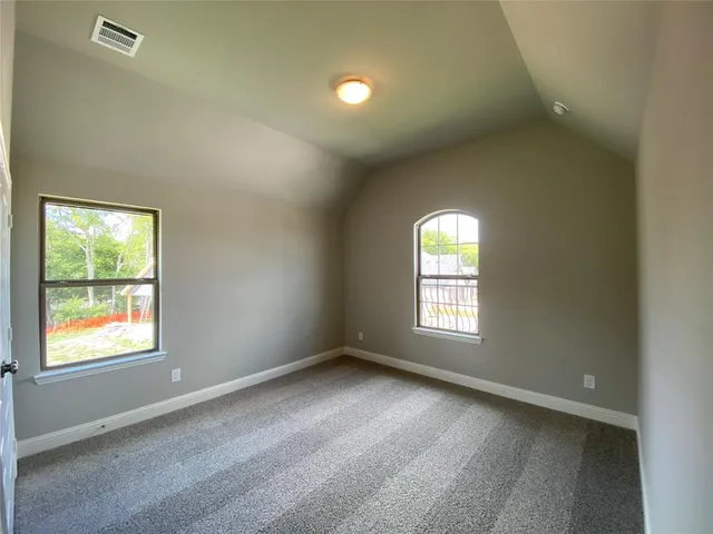 a view of a porch and garden