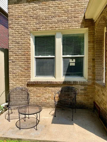 a front view of a house with parking space