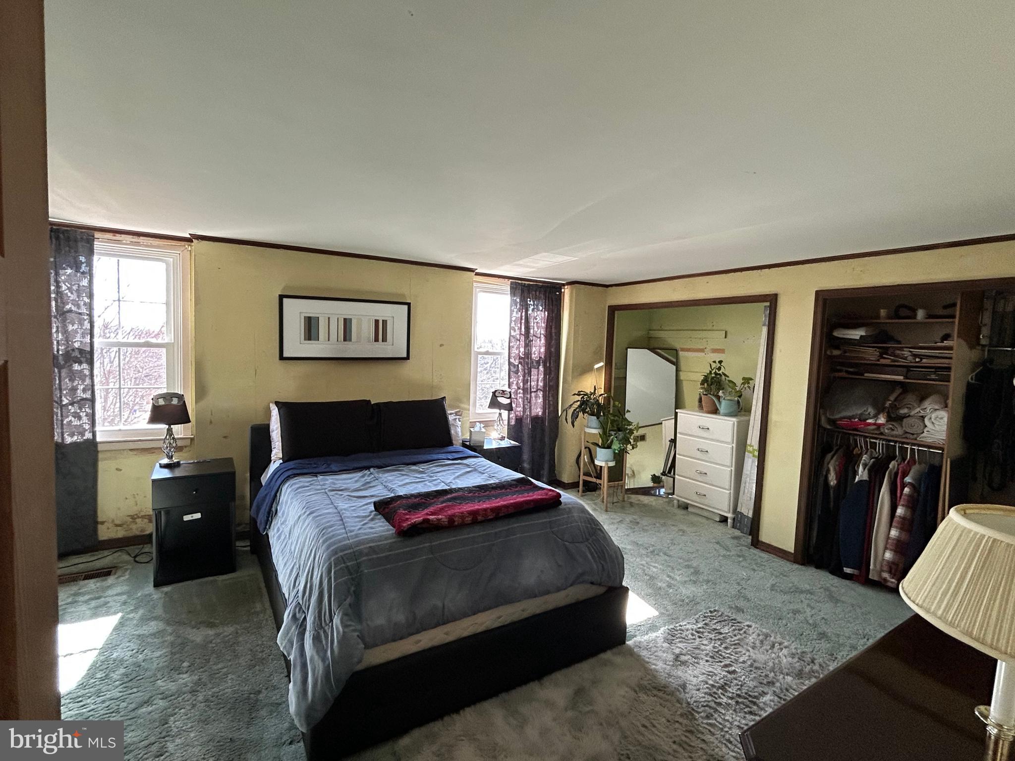 3243 Morrell Avenue Philadelphia, PA 19114 - Photo 17 of 28 a bedroom with a bed and wooden floor