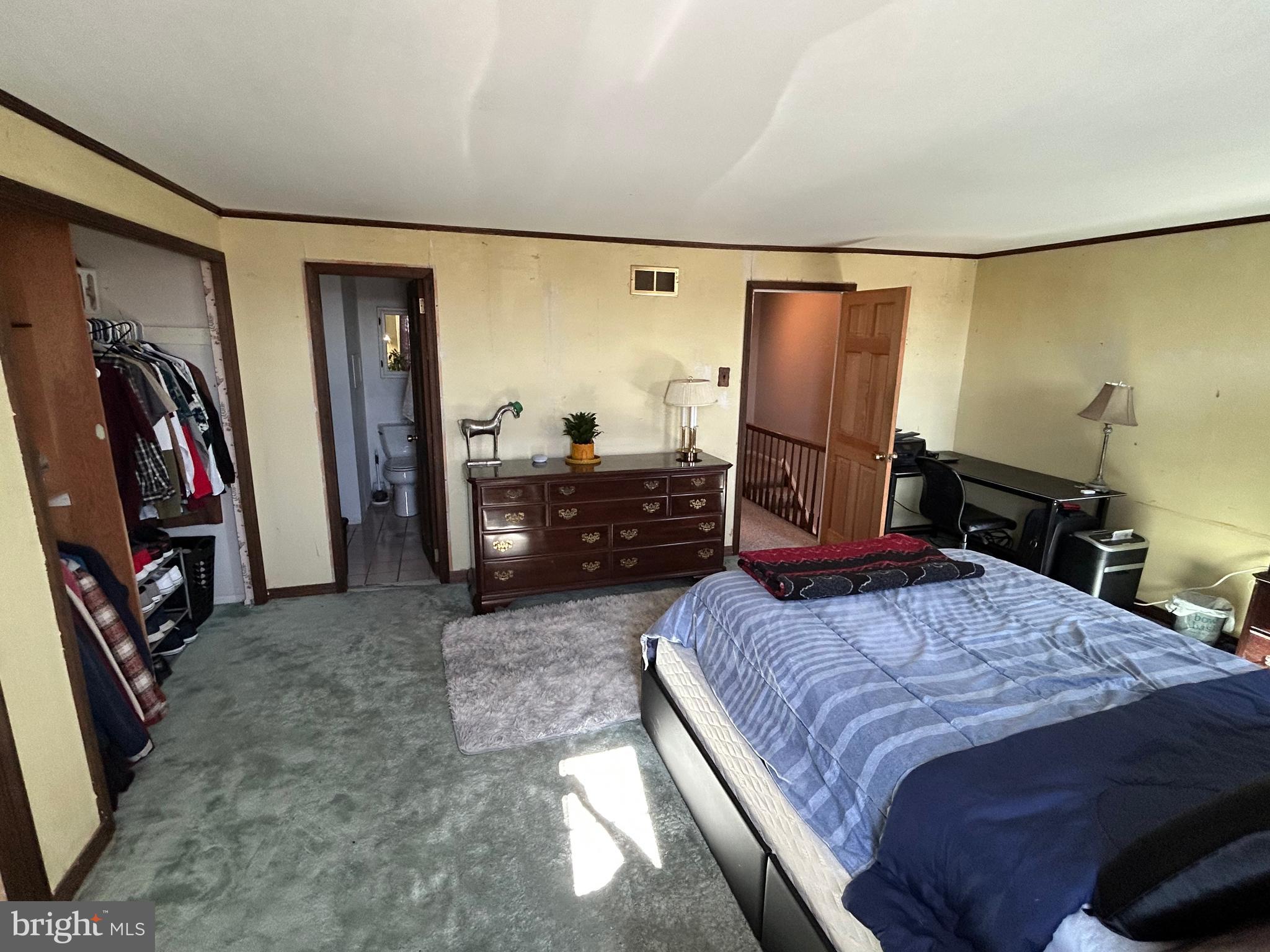 3243 Morrell Avenue Philadelphia, PA 19114 - Photo 18 of 28 a bedroom with a bed and a walk in closet