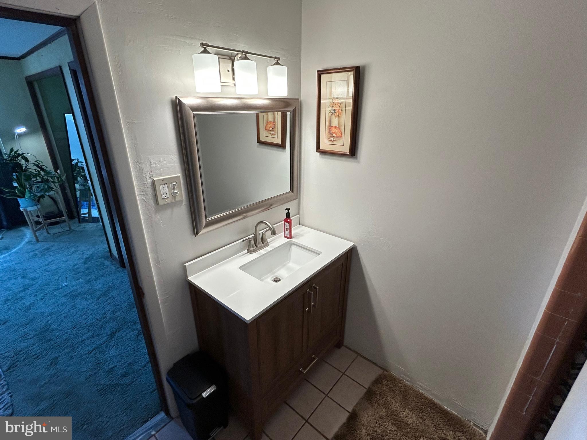 3243 Morrell Avenue Philadelphia, PA 19114 - Photo 20 of 28 a bathroom with a sink a mirror and vanity