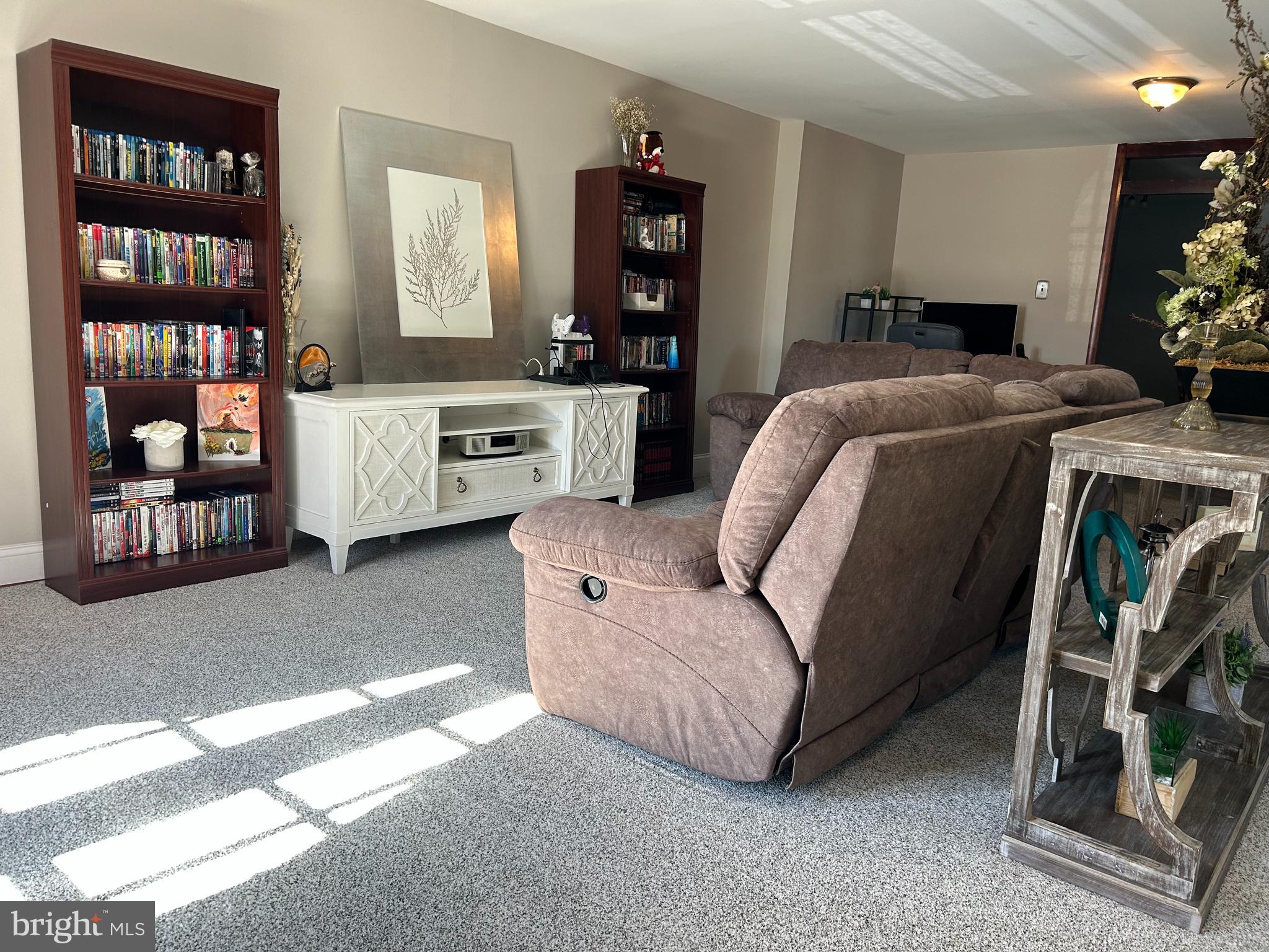 3243 Morrell Avenue Philadelphia, PA 19114 - Photo 2 of 28 a living room with furniture a bookshelf and a window