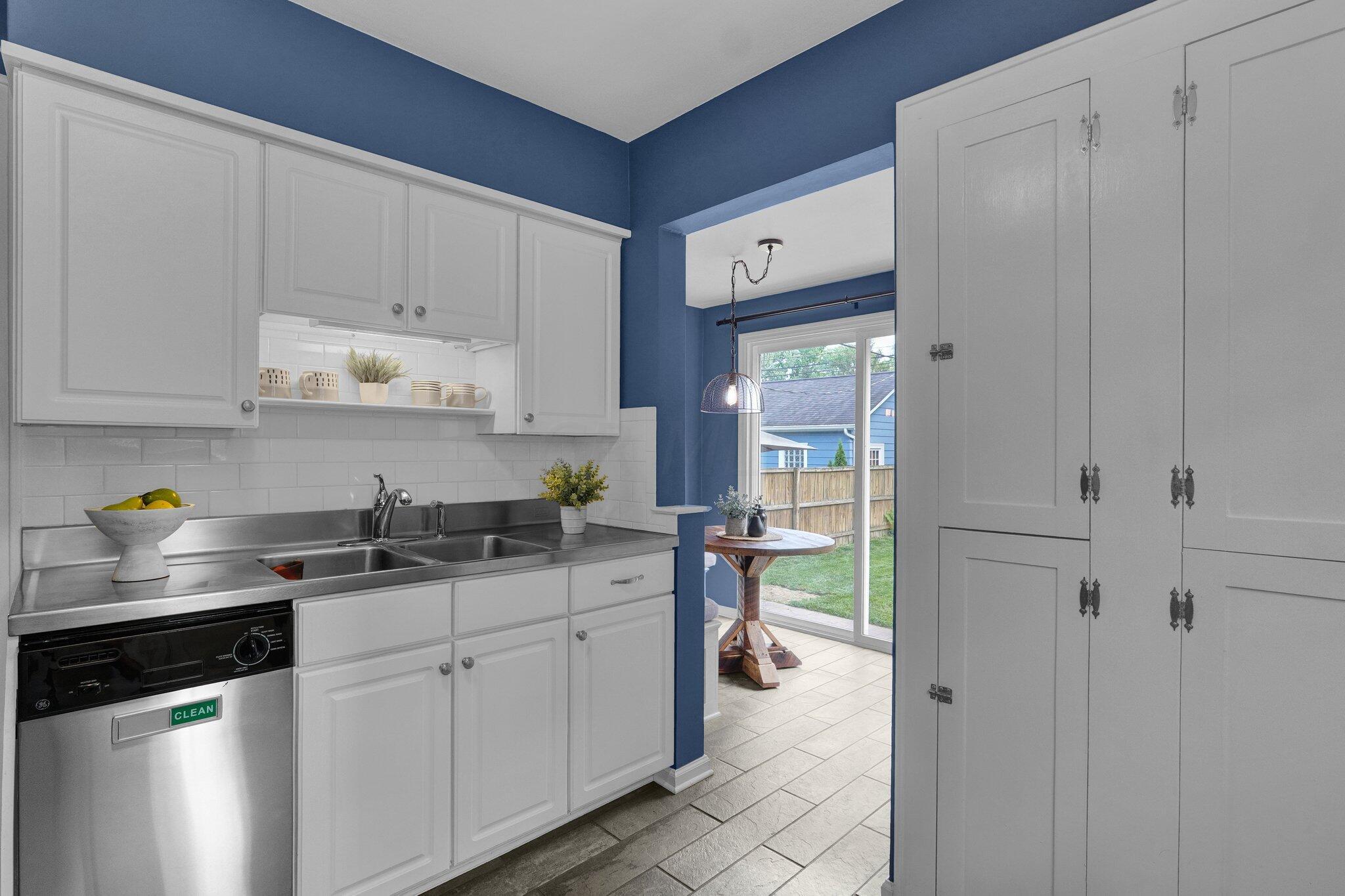 461 Arden Road Columbus, OH 43214 - Photo 15 of 42 Beautiful kitchen with stainless steel counters, appliances, ceramic tile flooring and a wall of original built-ins for all your cooking gadgetry!