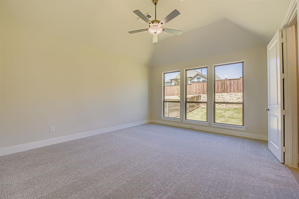 158 Sandie Drive Rhome, TX 76078 - Photo 14 of 25 an empty room with a window and a fan