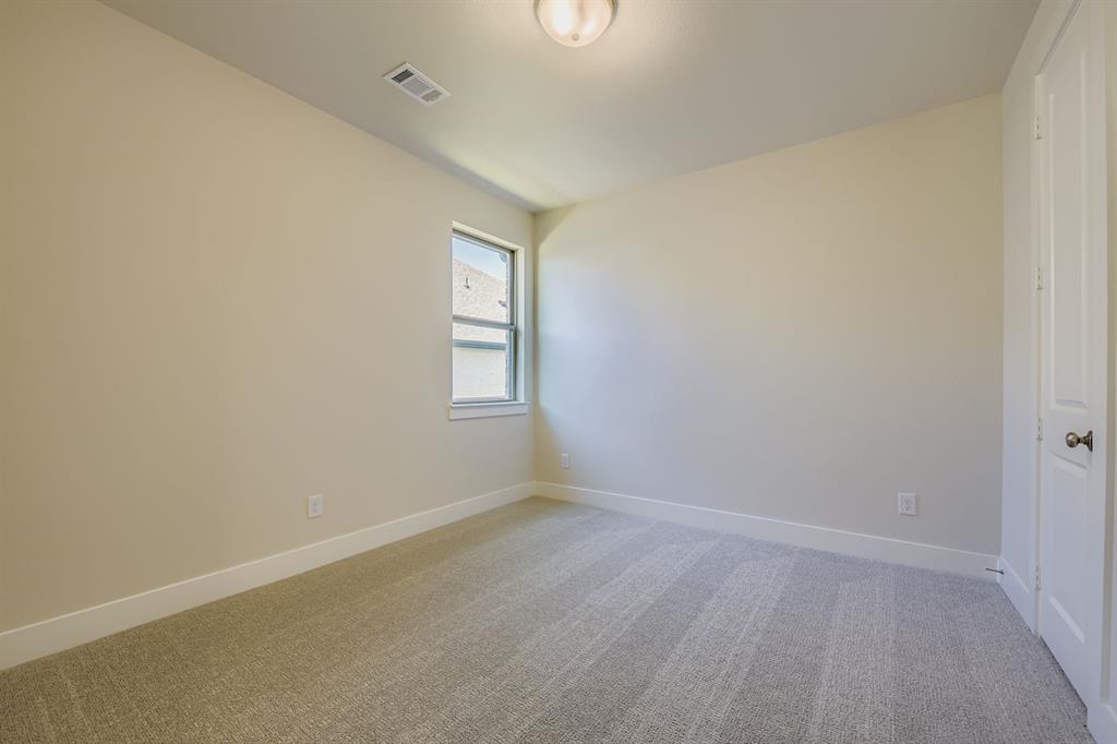 158 Sandie Drive Rhome, TX 76078 - Photo 19 of 25 an empty room with windows
