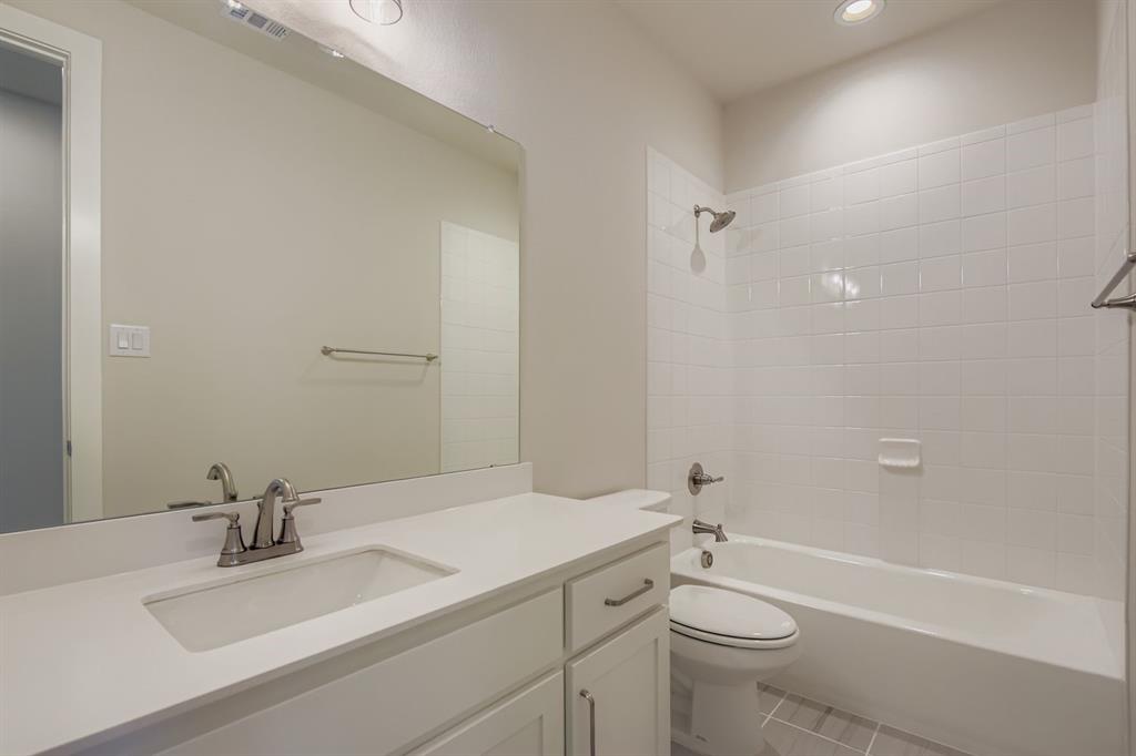 158 Sandie Drive Rhome, TX 76078 - Photo 23 of 25 a bathroom with a sink a toilet and shower