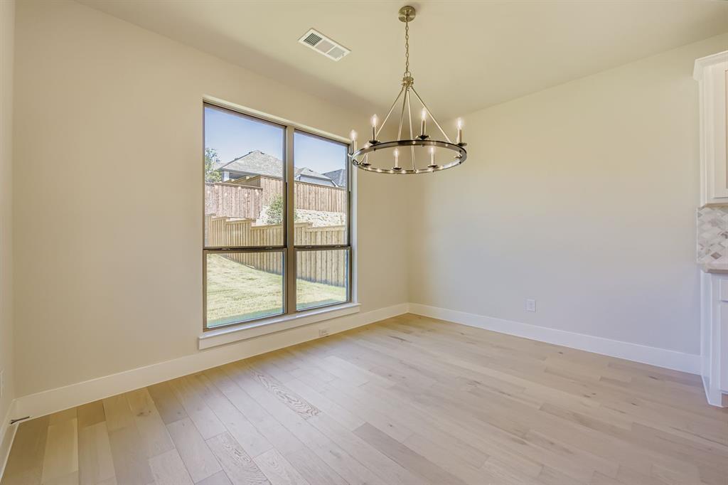 158 Sandie Drive Rhome, TX 76078 - Photo 6 of 25 a view of empty room with wooden floor and fan