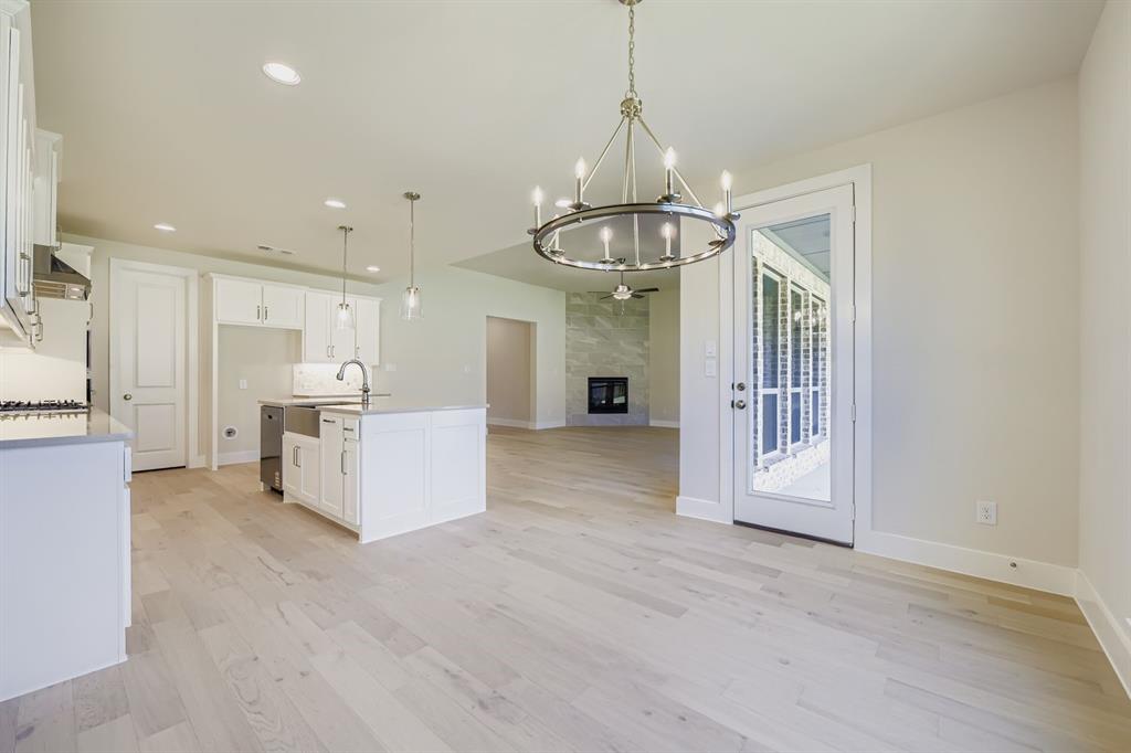 158 Sandie Drive Rhome, TX 76078 - Photo 7 of 25 a view of a hallway with stainless steel appliances granite countertop furniture