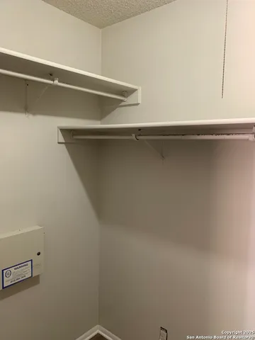 a balcony with wooden floor and yard in the back