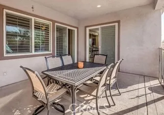 a view of a dining room with furniture and window