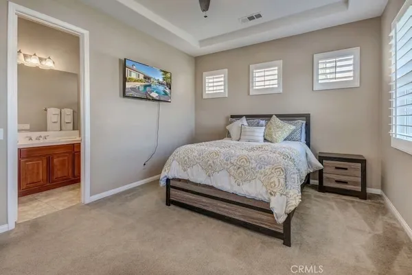 a bedroom with a bed and a cabinets