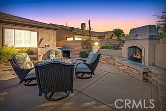 a living room with furniture a window and a fireplace