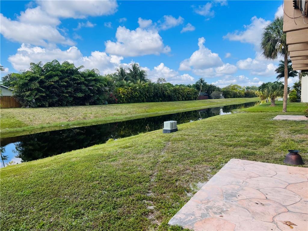 10930 Royal Palm Boulevard, Unit 10930 Coral Springs, FL 33065 - Photo 11 of 11 a view of a lake with a big yard