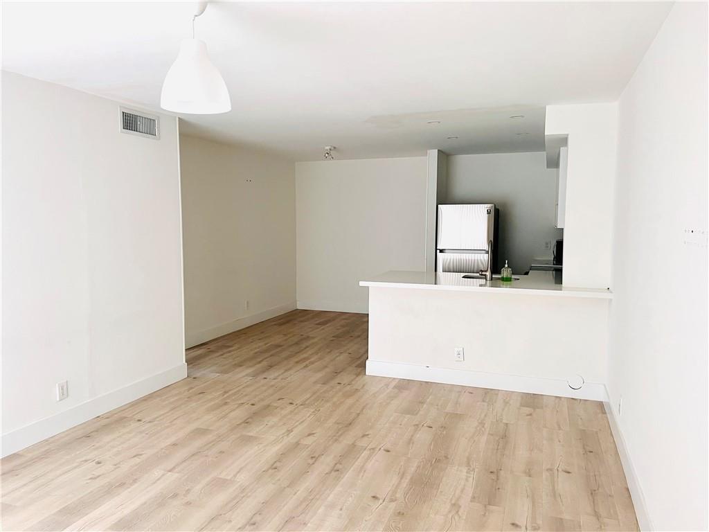 10930 Royal Palm Boulevard, Unit 10930 Coral Springs, FL 33065 - Photo 4 of 11 a view of a room with a sink and mirror