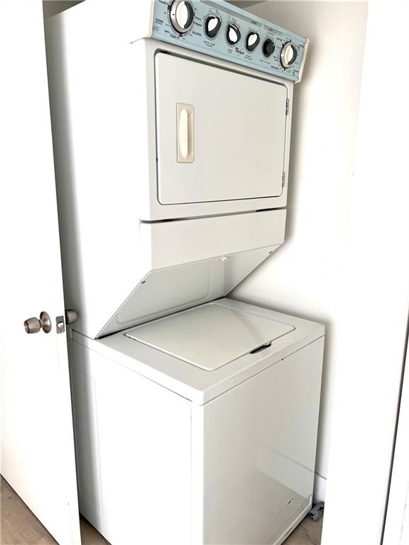 10930 Royal Palm Boulevard, Unit 10930 Coral Springs, FL 33065 - Photo 7 of 11 a utility room with dryer and washer