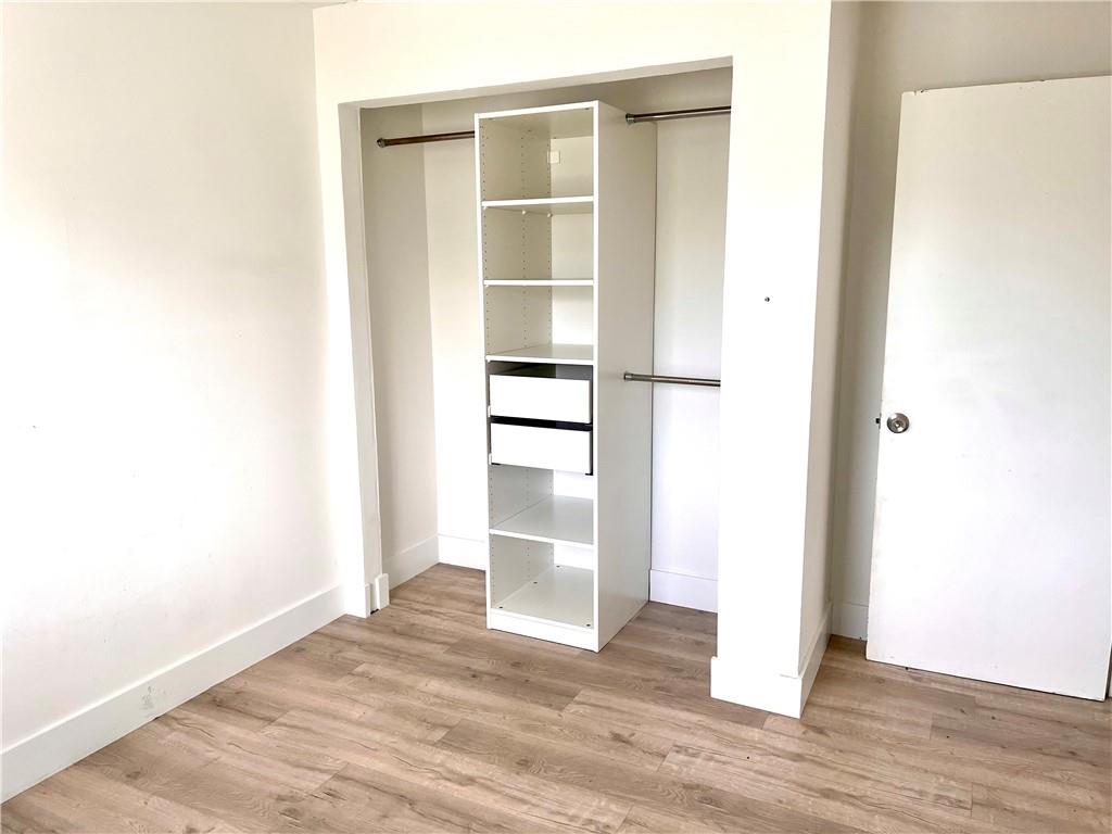 10930 Royal Palm Boulevard, Unit 10930 Coral Springs, FL 33065 - Photo 8 of 11 a view of a room with wooden floor