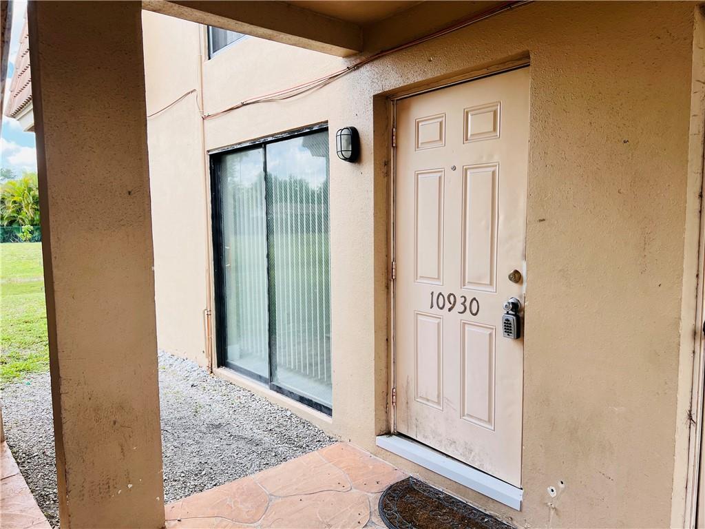 10930 Royal Palm Boulevard, Unit 10930 Coral Springs, FL 33065 - Photo 10 of 11 a view of a front door of the house