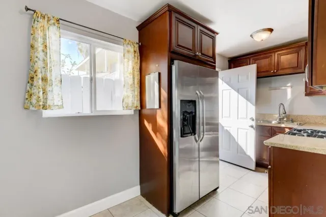 a kitchen with granite countertop a stove and a sink