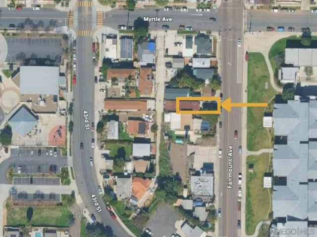 a balcony with wooden floor and fence